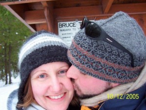 The authors, stopped for a smooch while snowshoeing the Bruce Trail near Tobermory.